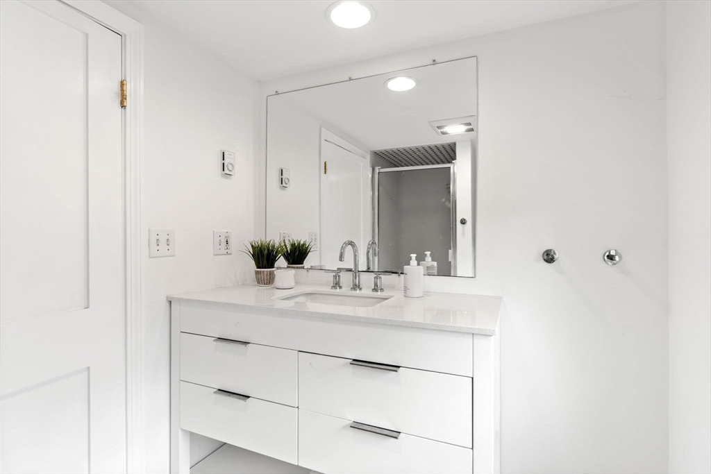 28 Rose Avenue Marblehead, MA 01945 - Photo 24 of 31 a bathroom with a sink and a mirror