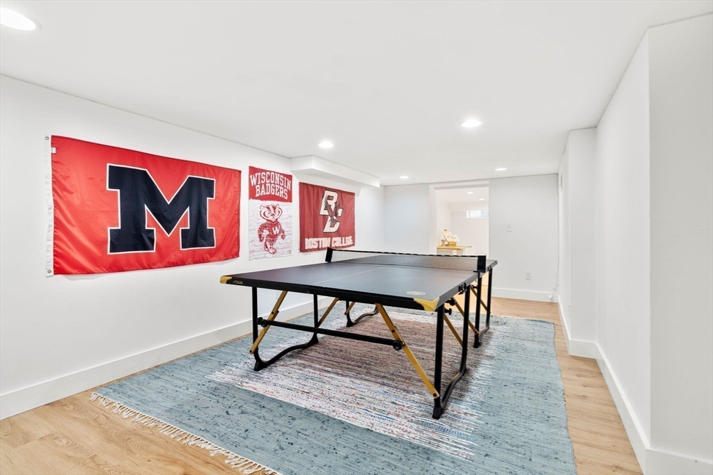 28 Rose Avenue Marblehead, MA 01945 - Photo 26 of 31 a view of a livingroom with furniture and wooden floor