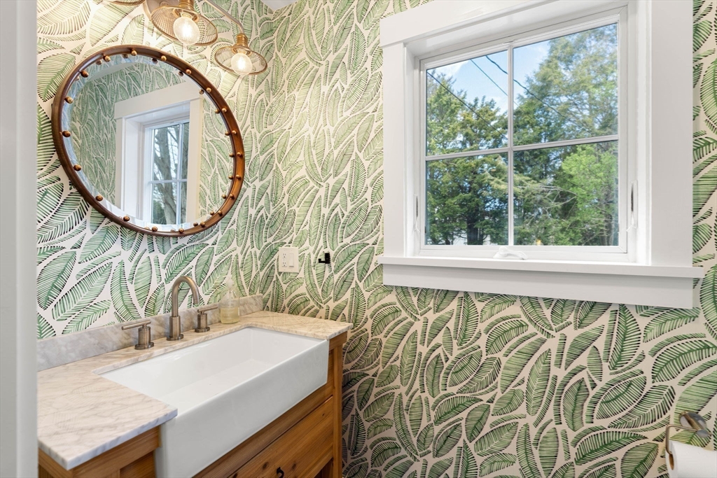 28 Rose Avenue Marblehead, MA 01945 - Photo 7 of 31 a bathroom with a sink and a mirror