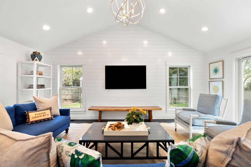 28 Rose Avenue Marblehead, MA 01945 - Photo 8 of 31 a living room with furniture a flat screen tv and a large window