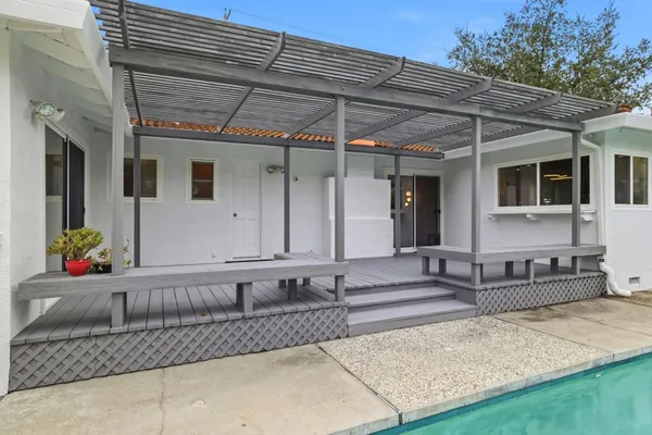 a view of a house with a tub and chairs