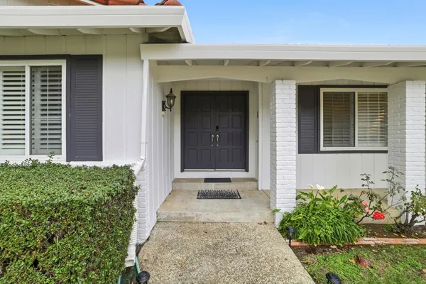 a front view of a house with an outdoor space