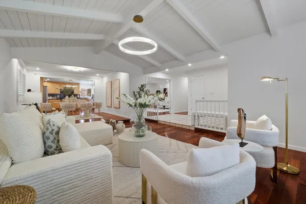 a living room with furniture and a table