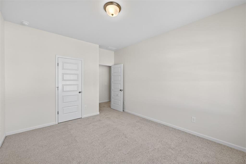 224 Bastian Drive, Unit 116 Villa Rica, GA 30180 - Photo 18 of 33 an empty room with closet