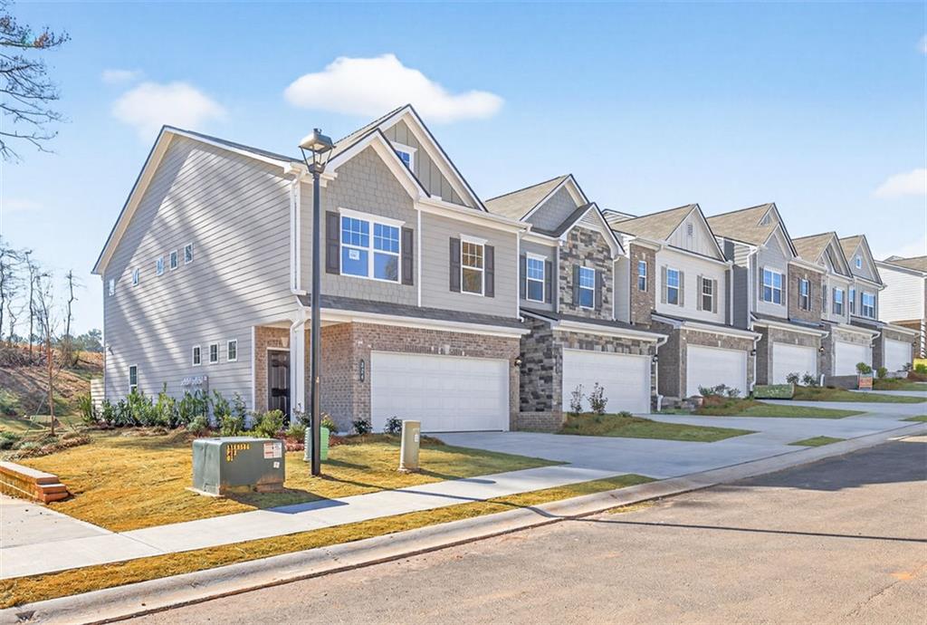224 Bastian Drive, Unit 116 Villa Rica, GA 30180 - Photo 2 of 33 a front view of a house with a yard