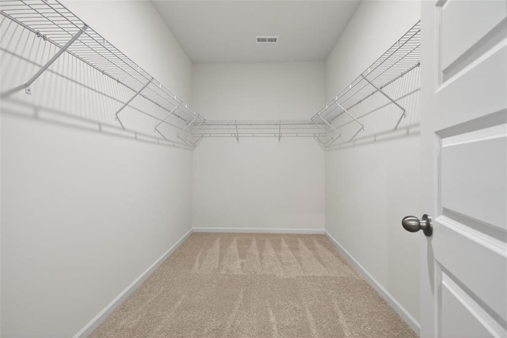 224 Bastian Drive, Unit 116 Villa Rica, GA 30180 - Photo 32 of 33 a view of a room with racks on the wall