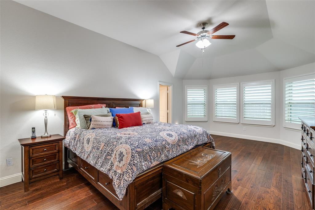 4217 Switchgrass Street Celina, TX 75009 - Photo 14 of 25 a bedroom with a bed and window
