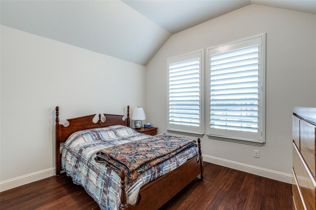 4217 Switchgrass Street Celina, TX 75009 - Photo 18 of 25 a bedroom with a bed and a window