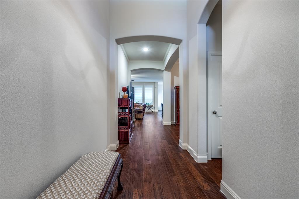 4217 Switchgrass Street Celina, TX 75009 - Photo 21 of 25 a view of a hallway with wooden floor