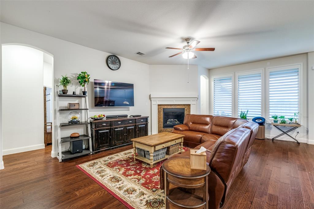 4217 Switchgrass Street Celina, TX 75009 - Photo 6 of 25 a living room with furniture fireplace and flat screen tv