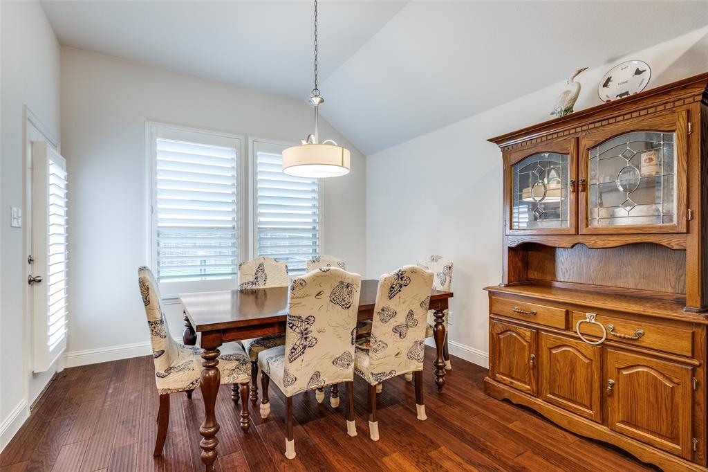 4217 Switchgrass Street Celina, TX 75009 - Photo 10 of 25 a view of a dining room with furniture window and wooden floor