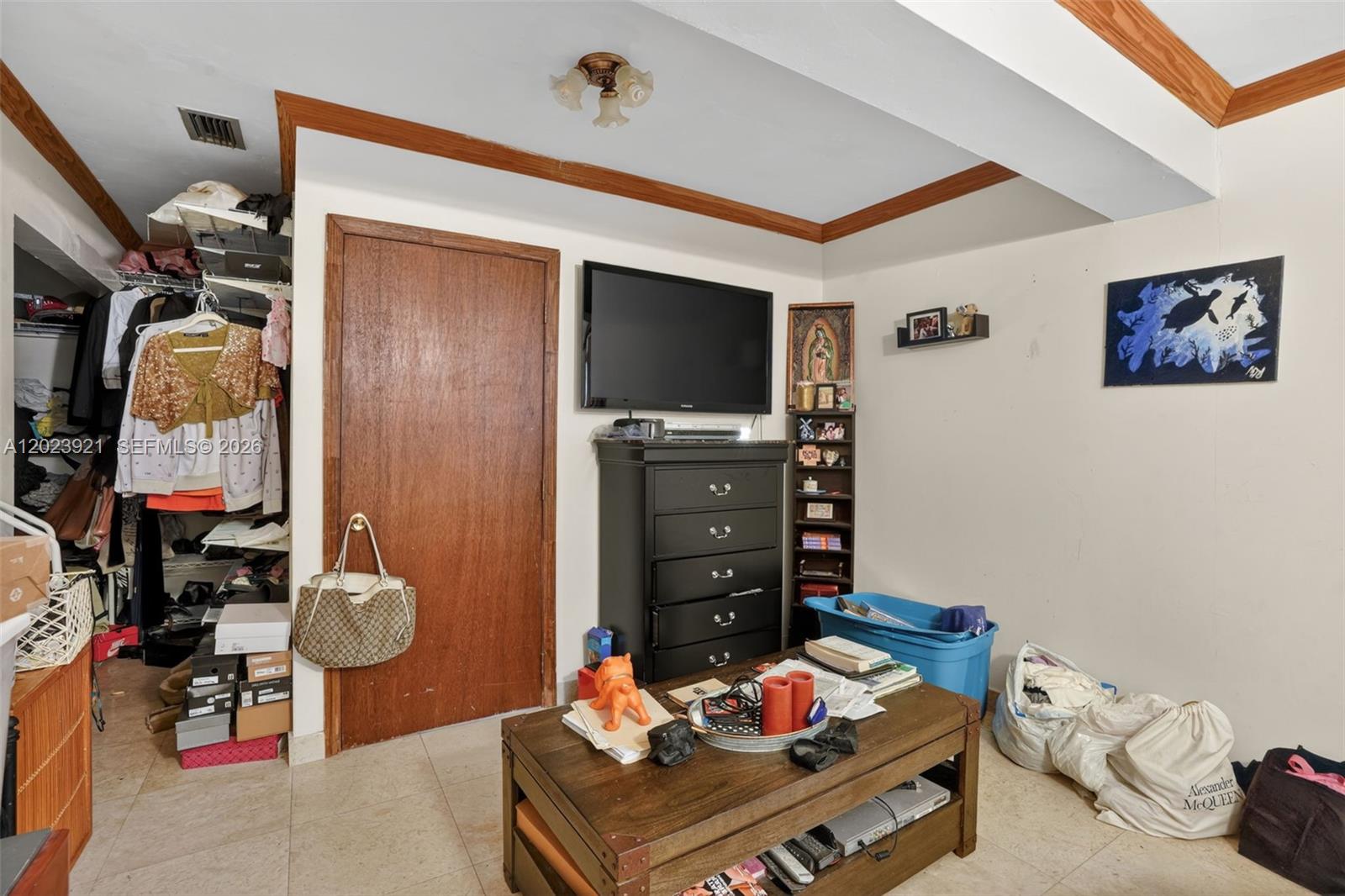 8461 Southwest 68th St Road Miami, FL 33143 - Photo 8 of 65 a living room with furniture and a flat screen tv