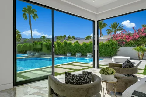 a view of a pool with a patio