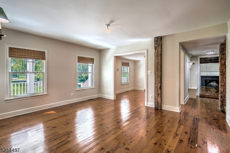 1815 Burnt Mills Road Bedminster, NJ 07921 - Photo 11 of 27 a view of empty room with wooden floor and fan