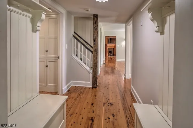 a view of hallway with wooden floor