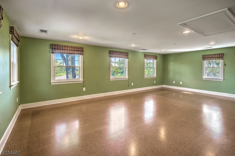 1815 Burnt Mills Road Bedminster, NJ 07921 - Photo 16 of 27 a view of empty room with wooden floor and fan