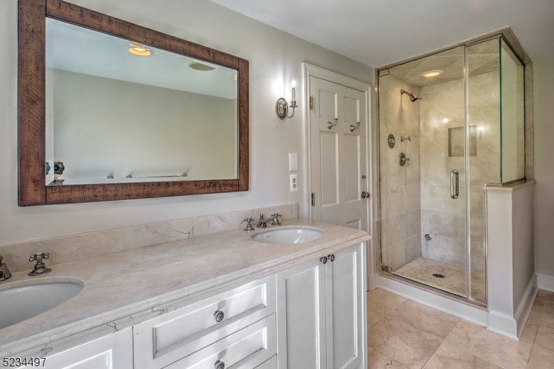 1815 Burnt Mills Road Bedminster, NJ 07921 - Photo 20 of 27 a bathroom with a granite countertop sink mirror and double