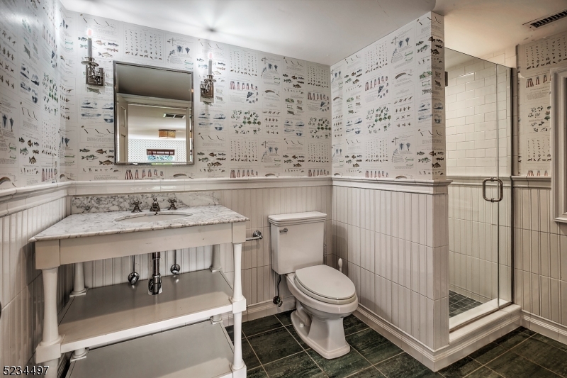 1815 Burnt Mills Road Bedminster, NJ 07921 - Photo 25 of 27 a bathroom with a sink a toilet and shower