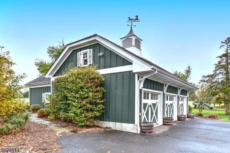 1815 Burnt Mills Road Bedminster, NJ 07921 - Photo 26 of 27 a front view of a house with a yard