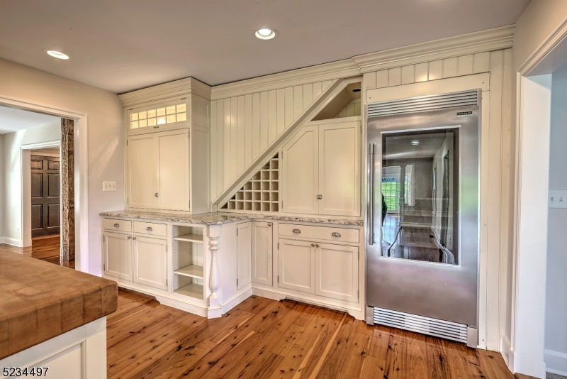 1815 Burnt Mills Road Bedminster, NJ 07921 - Photo 7 of 27 a kitchen with stainless steel appliances granite countertop a stove a sink and a refrigerator