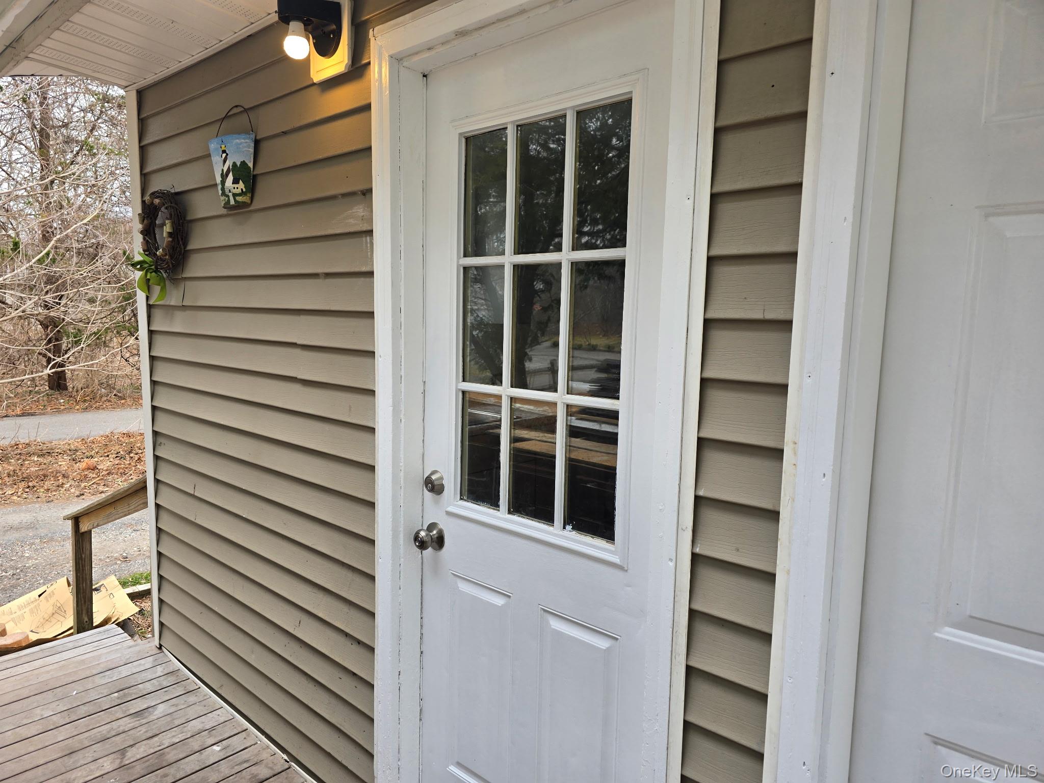 310 A Frowein Road Center Moriches, NY 11934 - Photo 1 of 5 a view of front door and deck