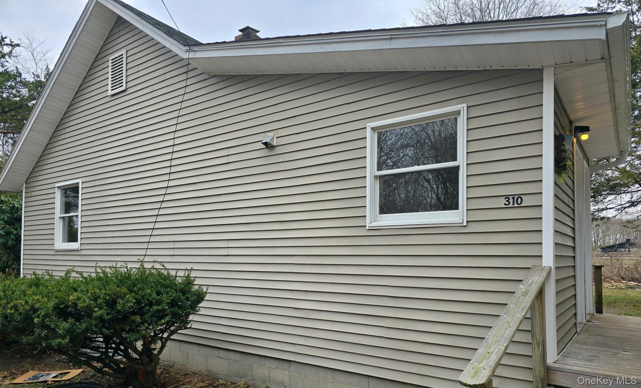 310 A Frowein Road Center Moriches, NY 11934 - Photo 2 of 5 a view of a house with a small space