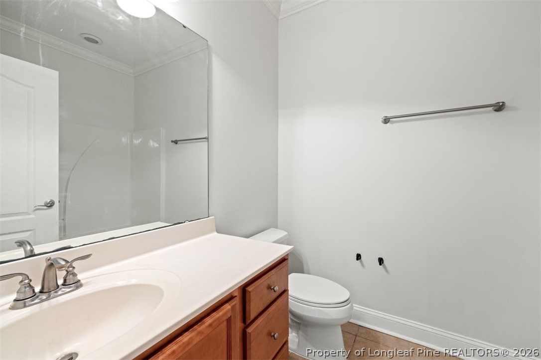 62 Gallery Drive, Unit 102 Spring Lake, NC 28390 - Photo 16 of 23 a bathroom with a sink toilet and vanity
