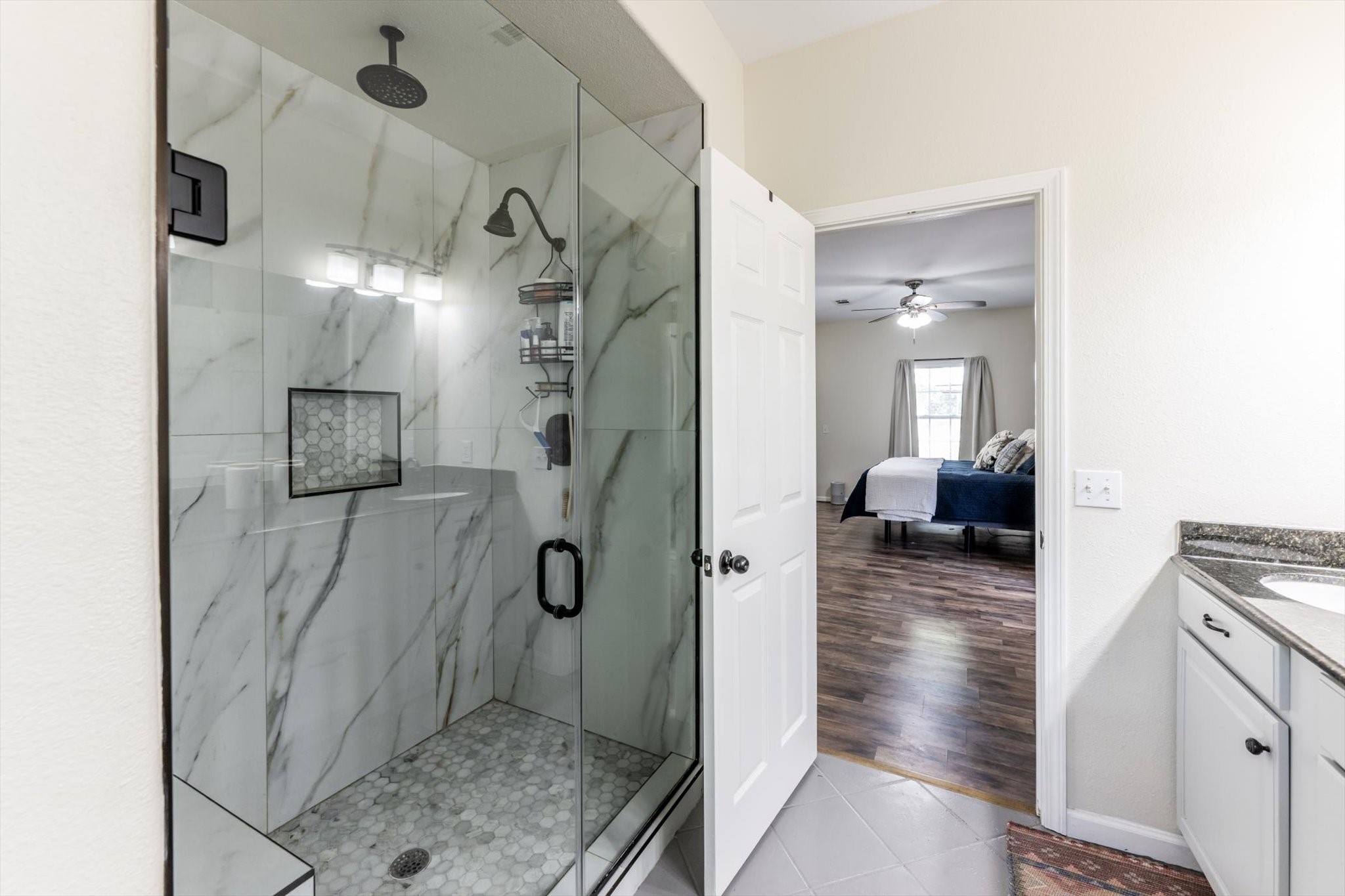 50 Canary Street Point Blank, TX 77364 - Photo 23 of 33 a bathroom with a sink and shower