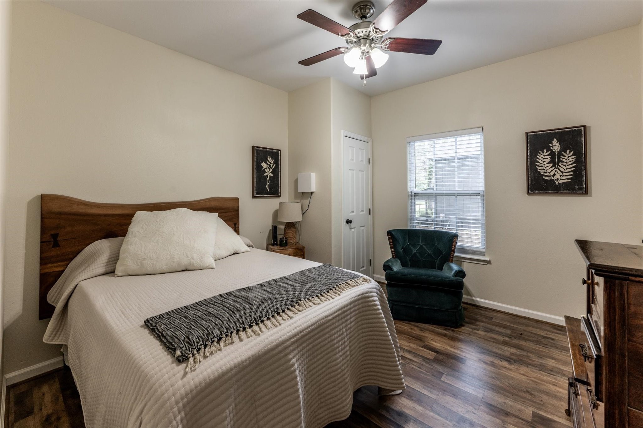 50 Canary Street Point Blank, TX 77364 - Photo 24 of 33 a bedroom with a bed and wooden floor