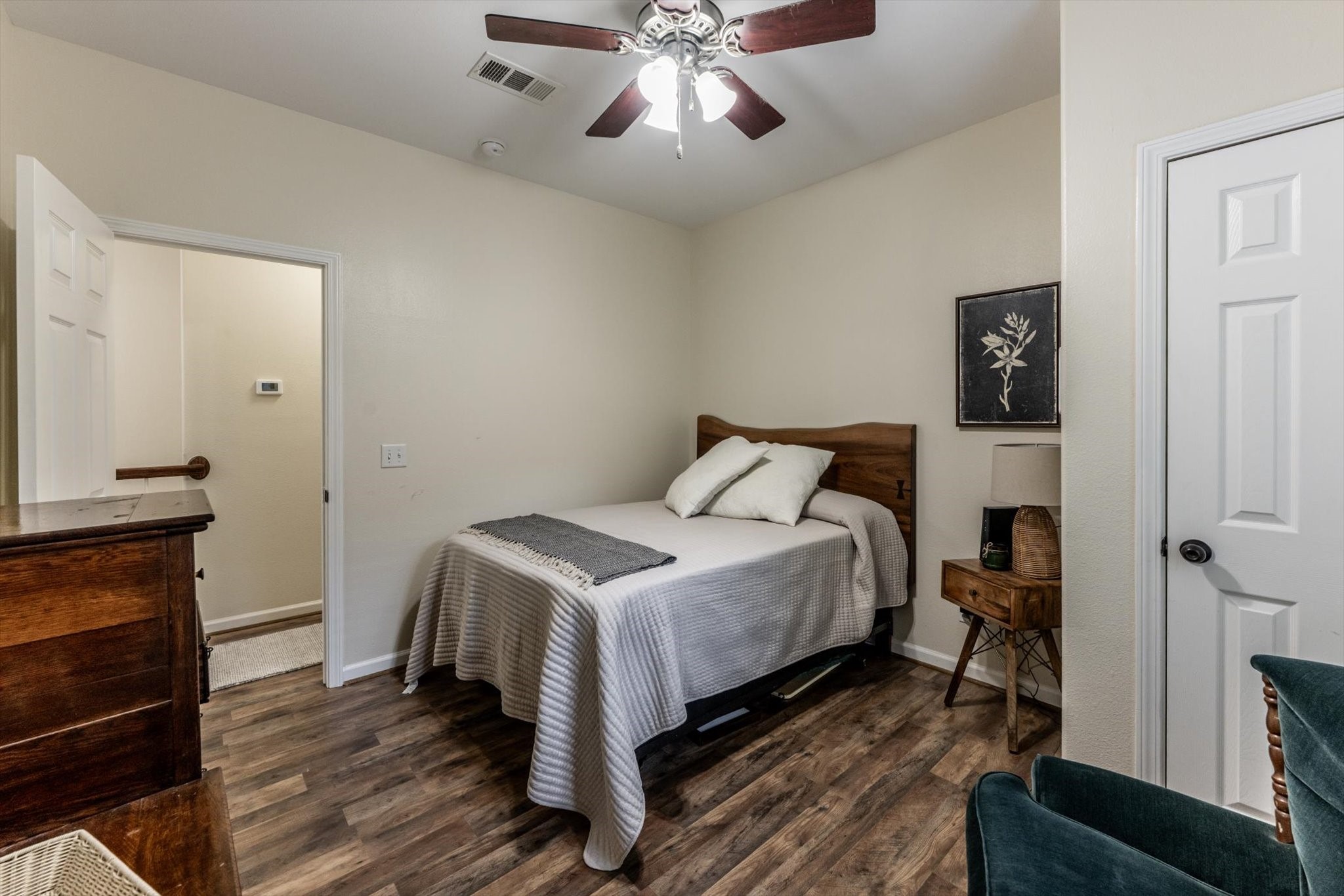 50 Canary Street Point Blank, TX 77364 - Photo 25 of 33 a bedroom with a bed and a chandelier