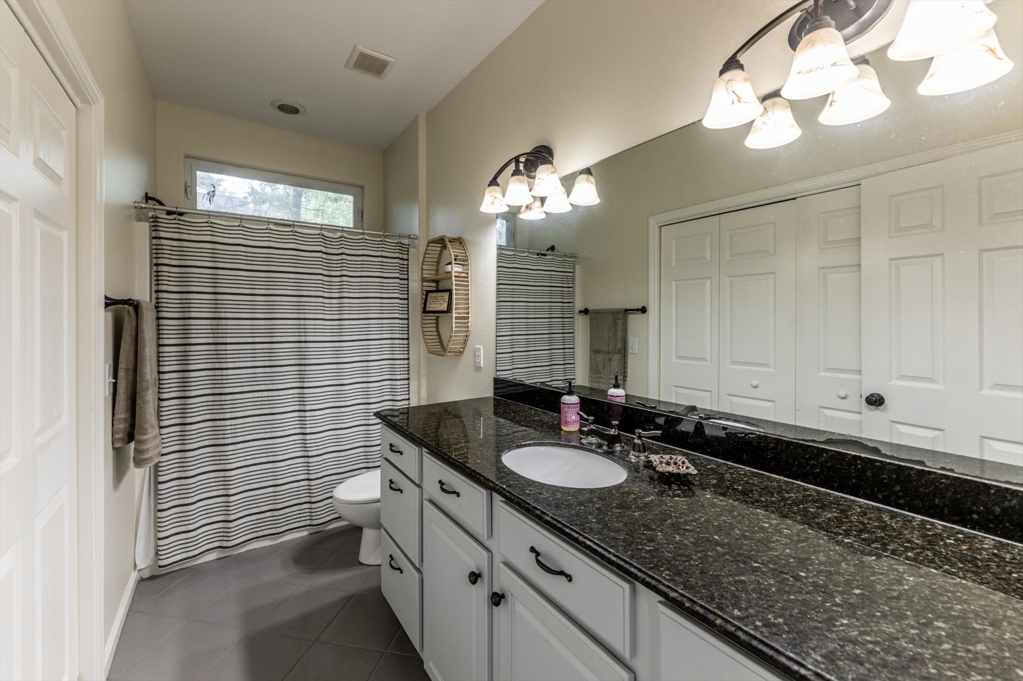 50 Canary Street Point Blank, TX 77364 - Photo 26 of 33 a bathroom with a sink double vanity and a mirror