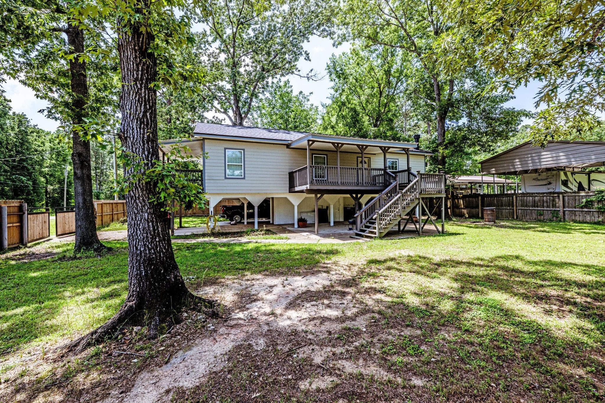 50 Canary Street Point Blank, TX 77364 - Photo 29 of 33 a view of a house with backyard and a tree