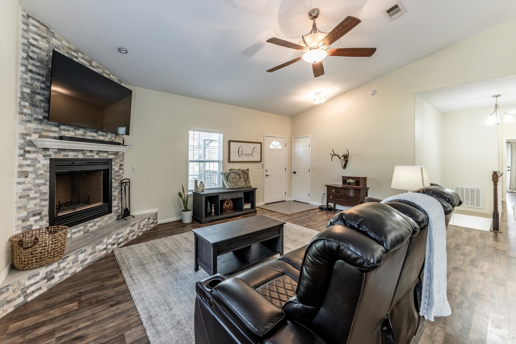 50 Canary Street Point Blank, TX 77364 - Photo 4 of 33 a living room with furniture a fireplace and a flat screen tv