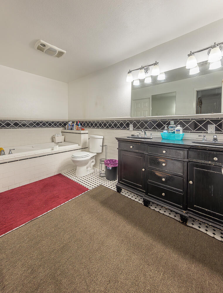 1724 East 2nd Street Lubbock, TX 79403 - Photo 9 of 20 a living room with granite countertop furniture and a kitchen view