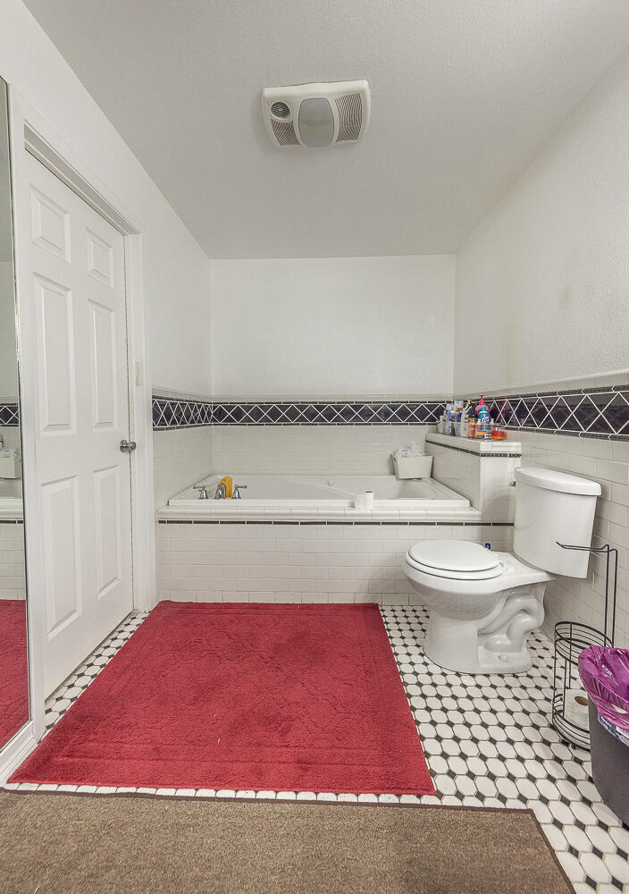 1724 East 2nd Street Lubbock, TX 79403 - Photo 10 of 20 a bathroom with a toilet