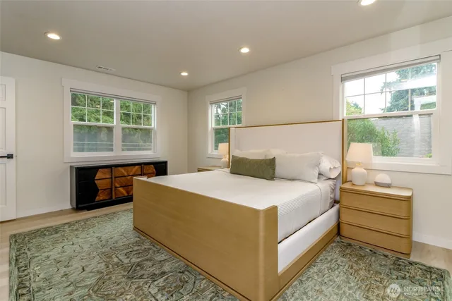 a bed room with a bed and a window