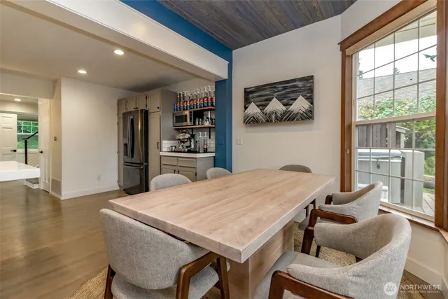 a open kitchen with a table and chairs