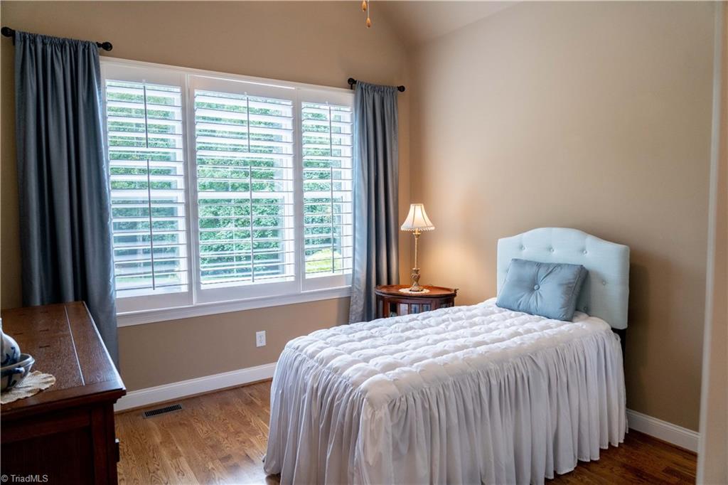 5688 Pepper Road Oak Ridge, NC 27310 - Photo 21 of 31 Downstairs Bedroom 2 with Full Bath