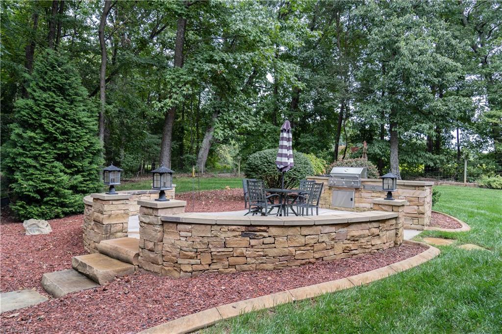 5688 Pepper Road Oak Ridge, NC 27310 - Photo 29 of 31 Patio with Outdoor Kitchen