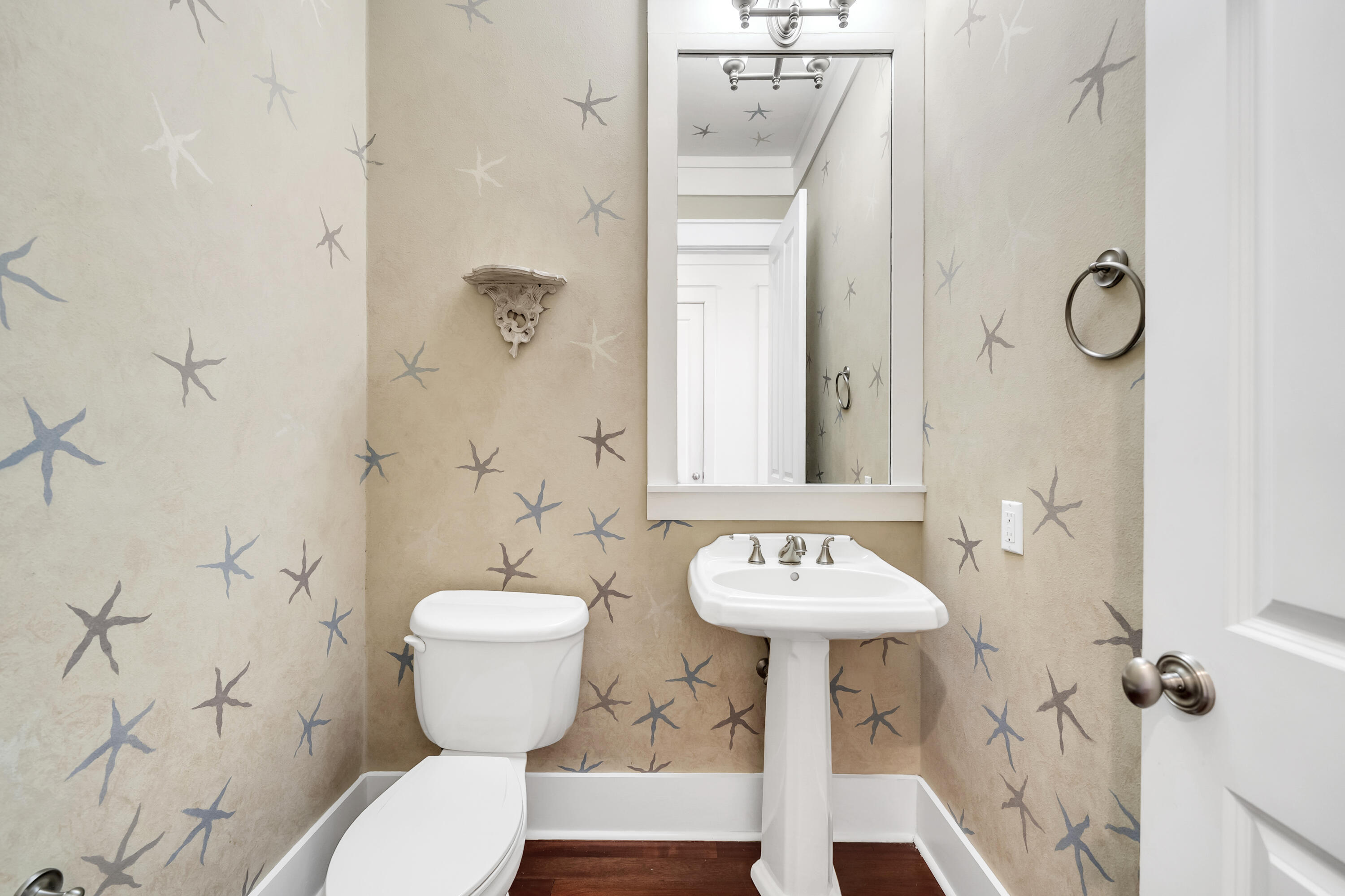 1303 Laurel Way Miramar Beach, FL 32550 - Photo 13 of 77 a bathroom with a sink toilet and a mirror