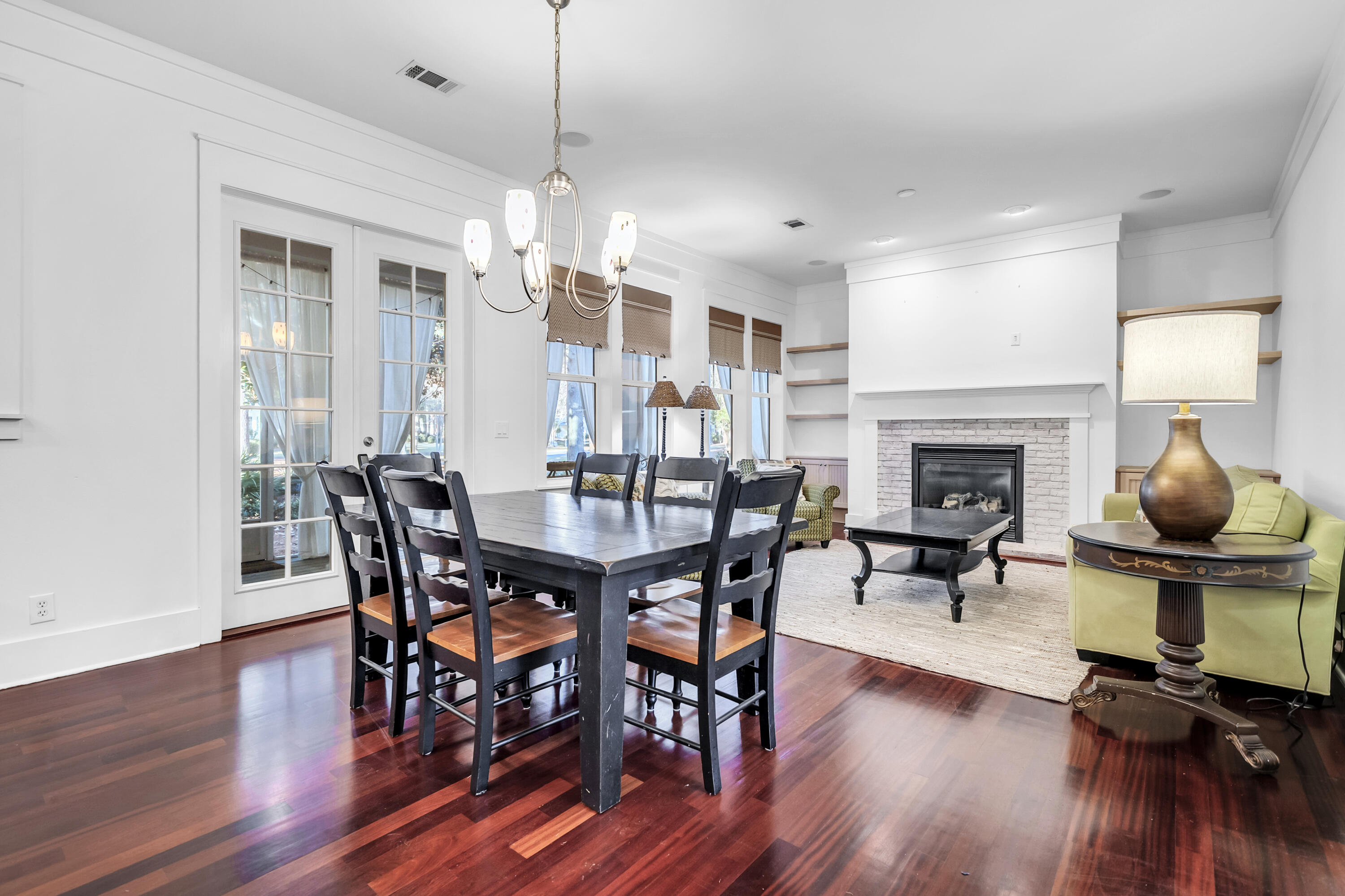 1303 Laurel Way Miramar Beach, FL 32550 - Photo 19 of 77 a view of a a dining room with furniture window and wooden floor