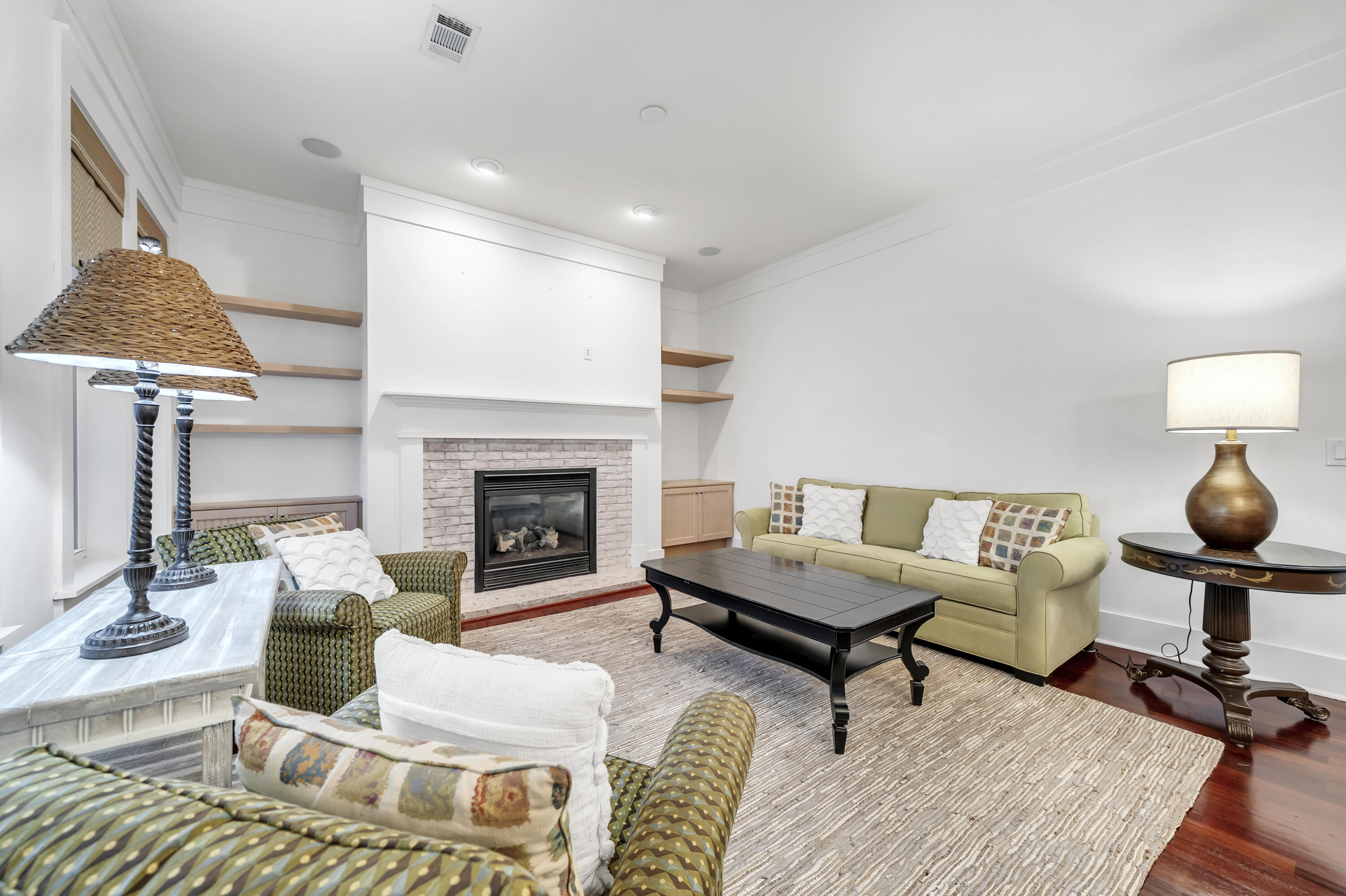 1303 Laurel Way Miramar Beach, FL 32550 - Photo 21 of 77 a living room with furniture and a fireplace
