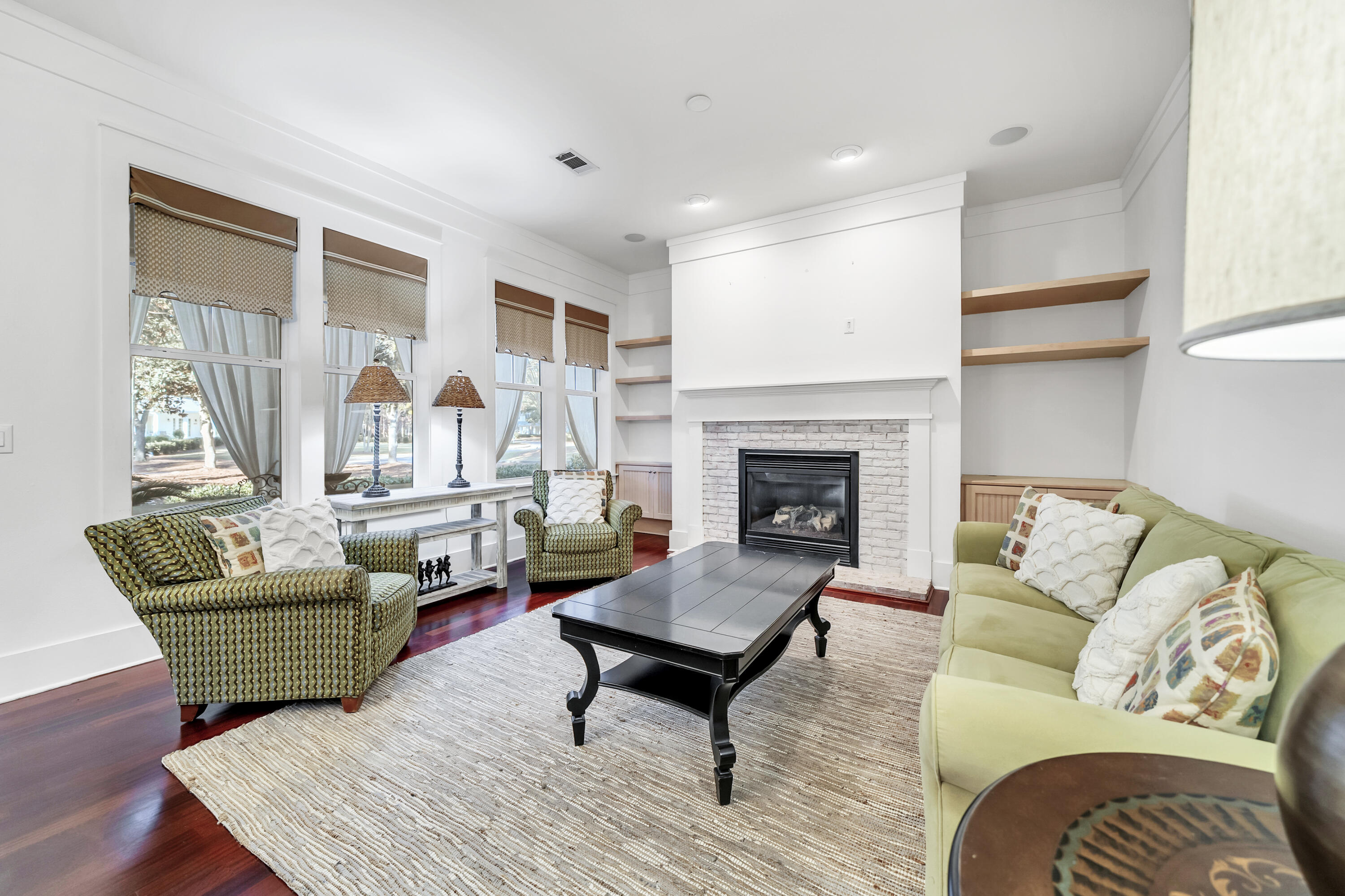 1303 Laurel Way Miramar Beach, FL 32550 - Photo 23 of 77 a living room with furniture and a fireplace