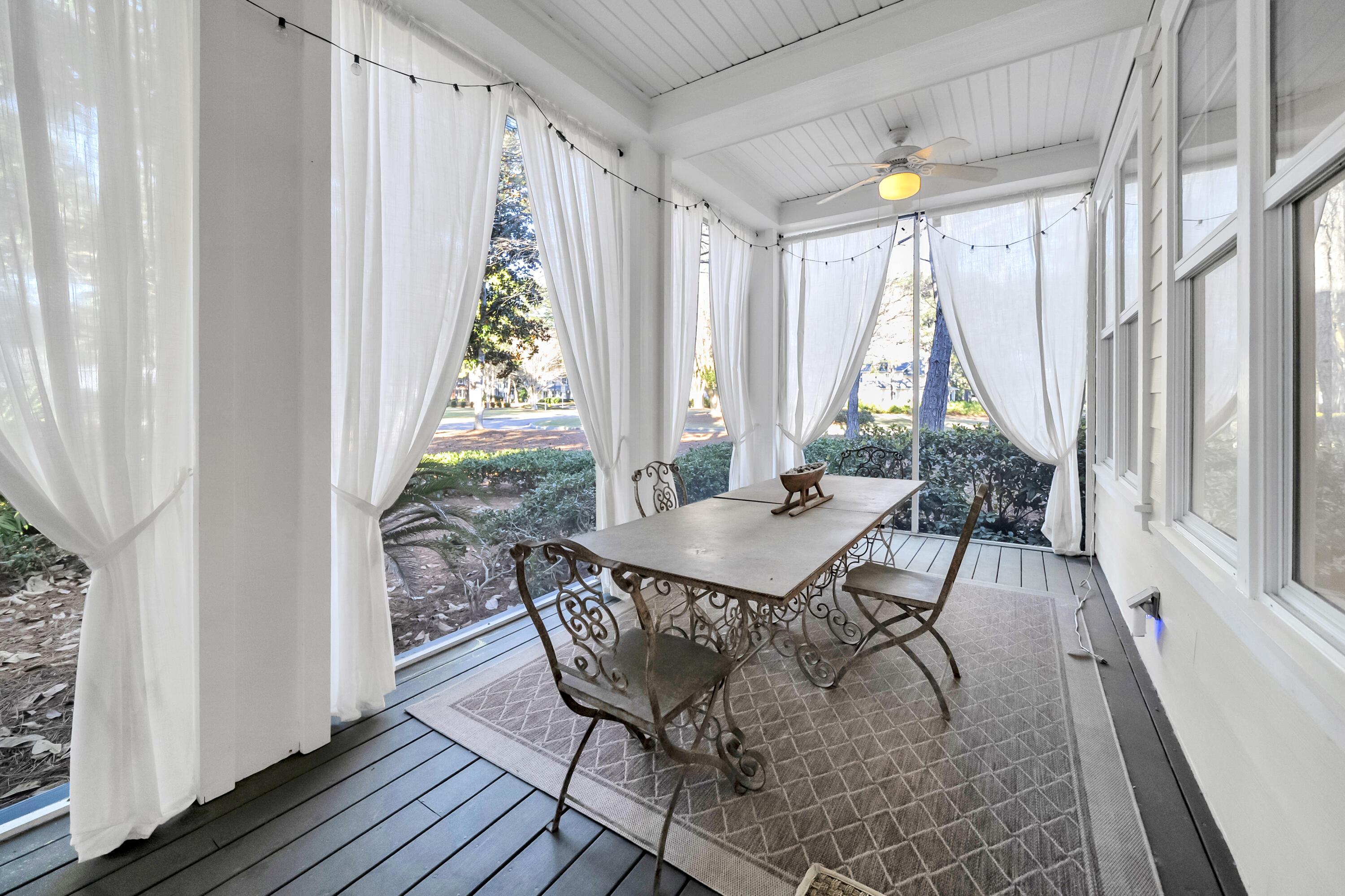 1303 Laurel Way Miramar Beach, FL 32550 - Photo 26 of 77 a view of a dining room with furniture window and wooden floor