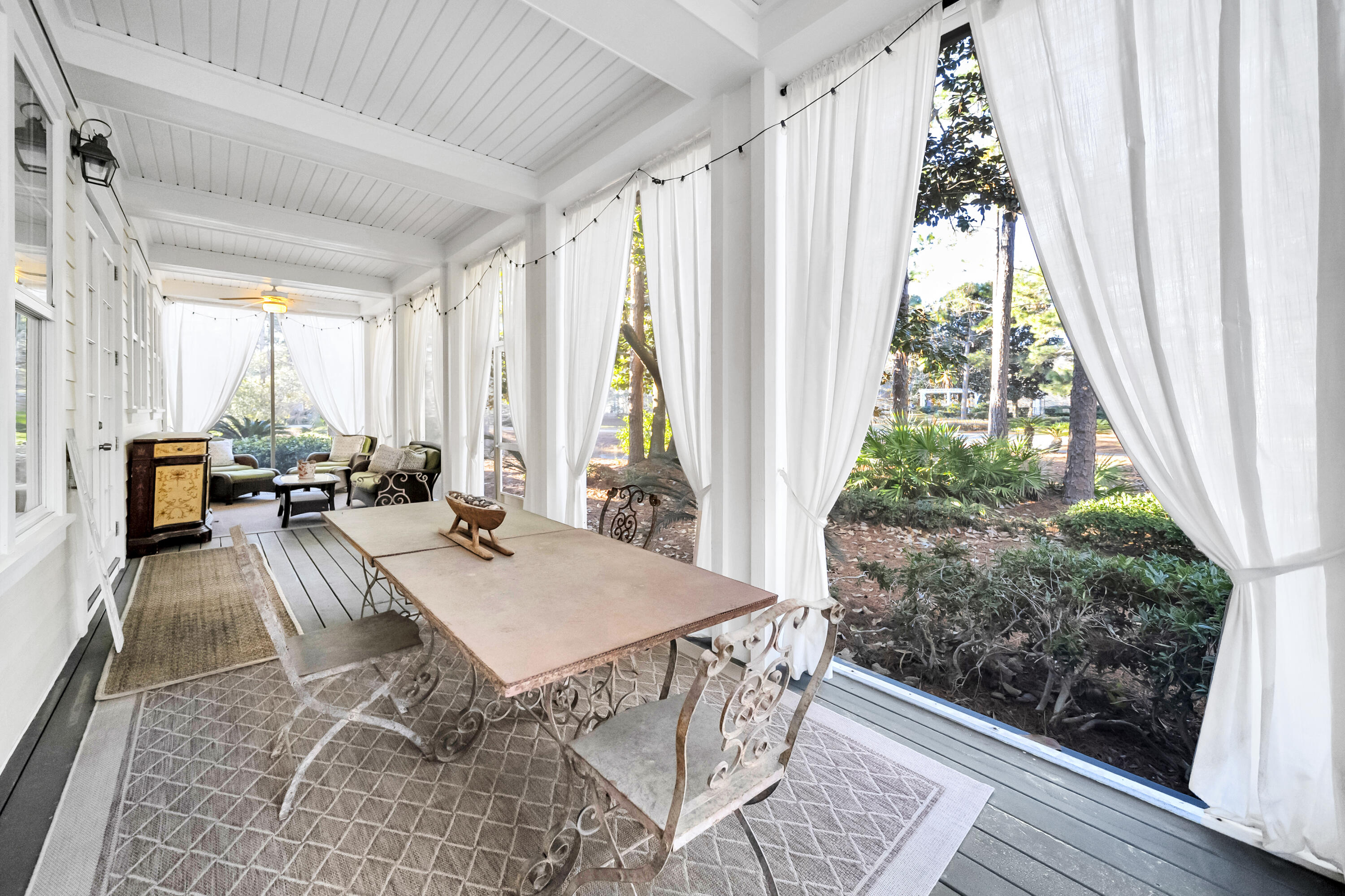 1303 Laurel Way Miramar Beach, FL 32550 - Photo 29 of 77 a view of a dining room with furniture window and wooden floor