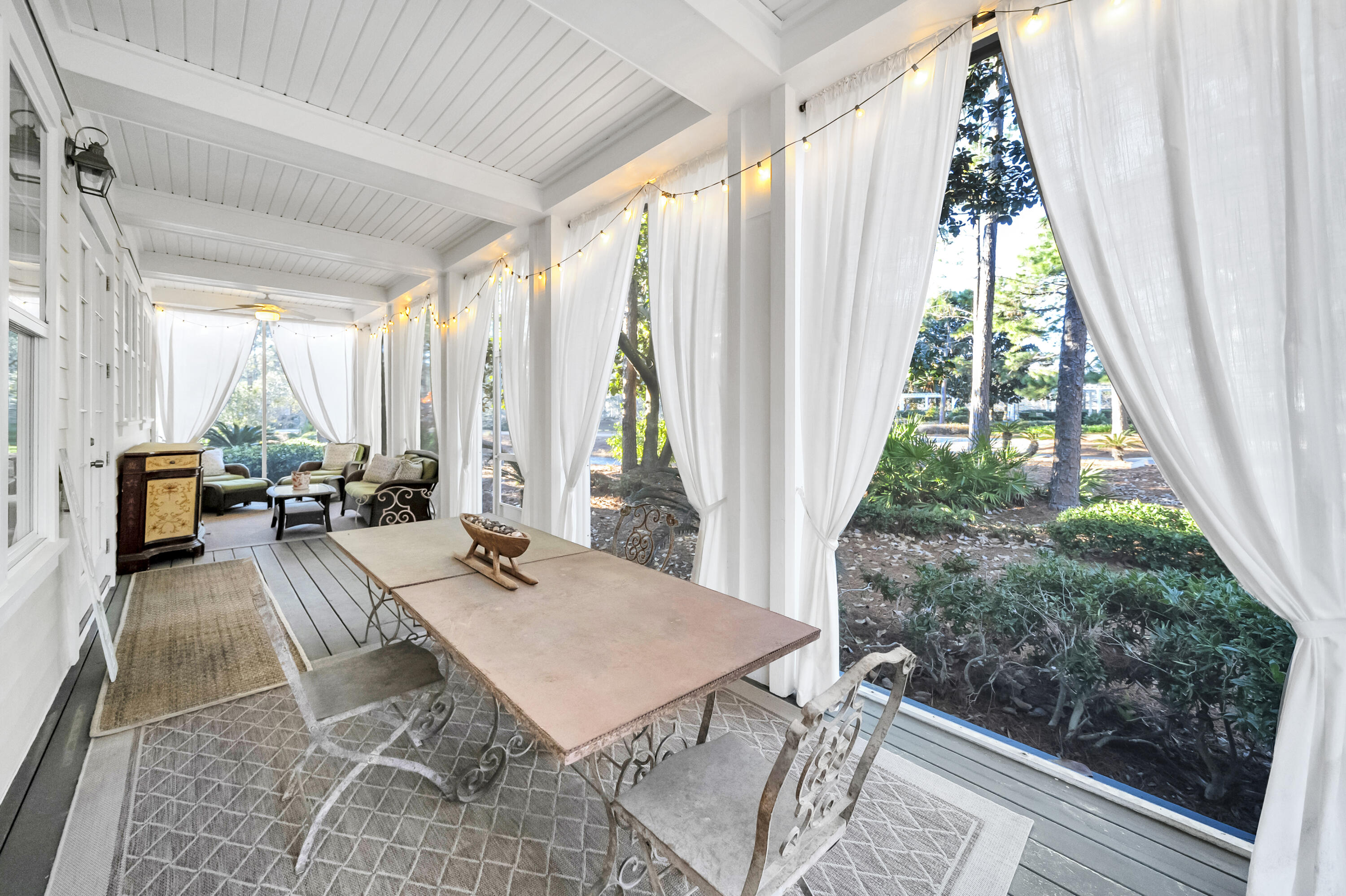 1303 Laurel Way Miramar Beach, FL 32550 - Photo 30 of 77 a view of a dining room with furniture window and wooden floor