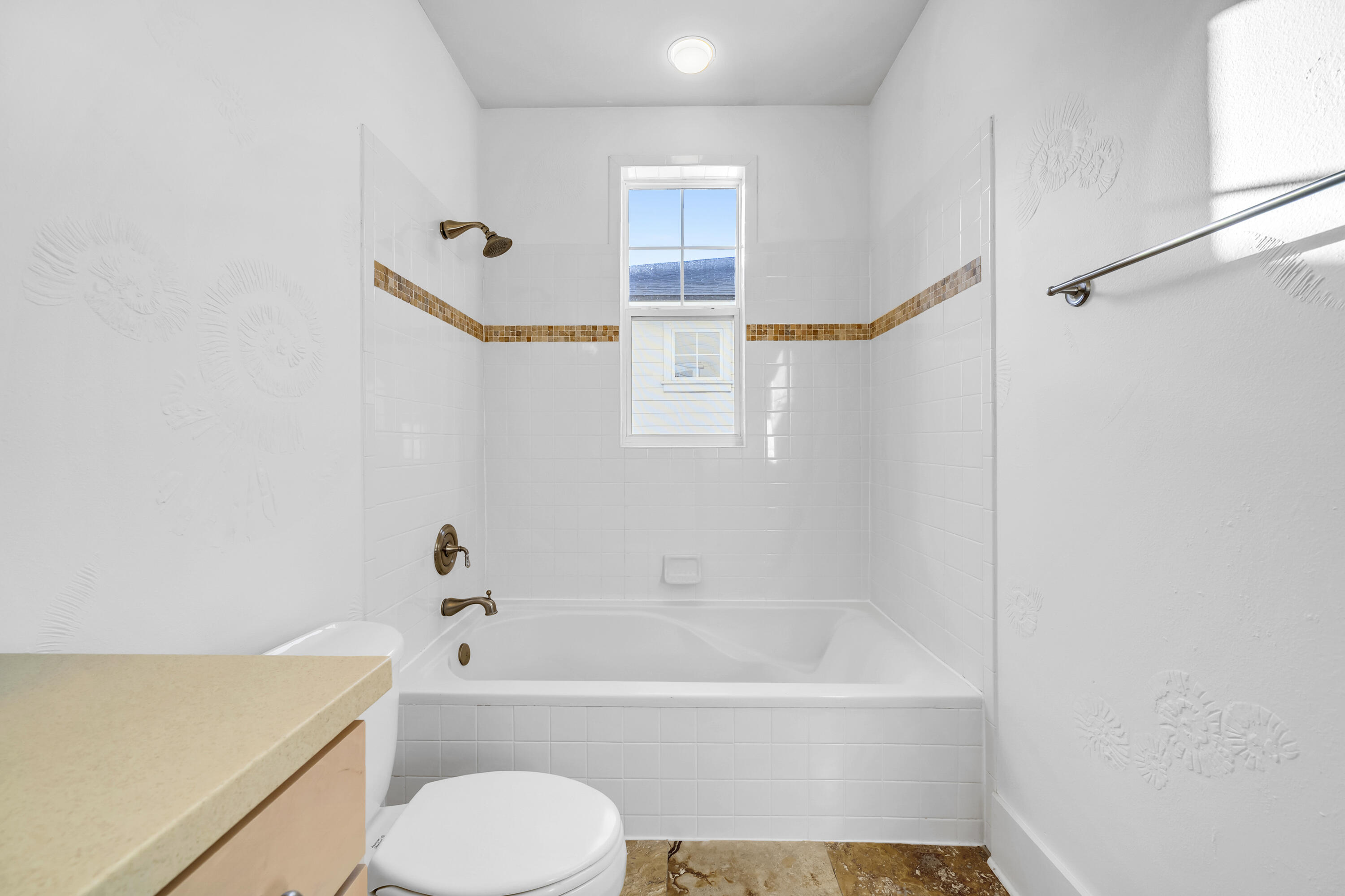 1303 Laurel Way Miramar Beach, FL 32550 - Photo 40 of 77 a bathroom with a bathtub and a shower