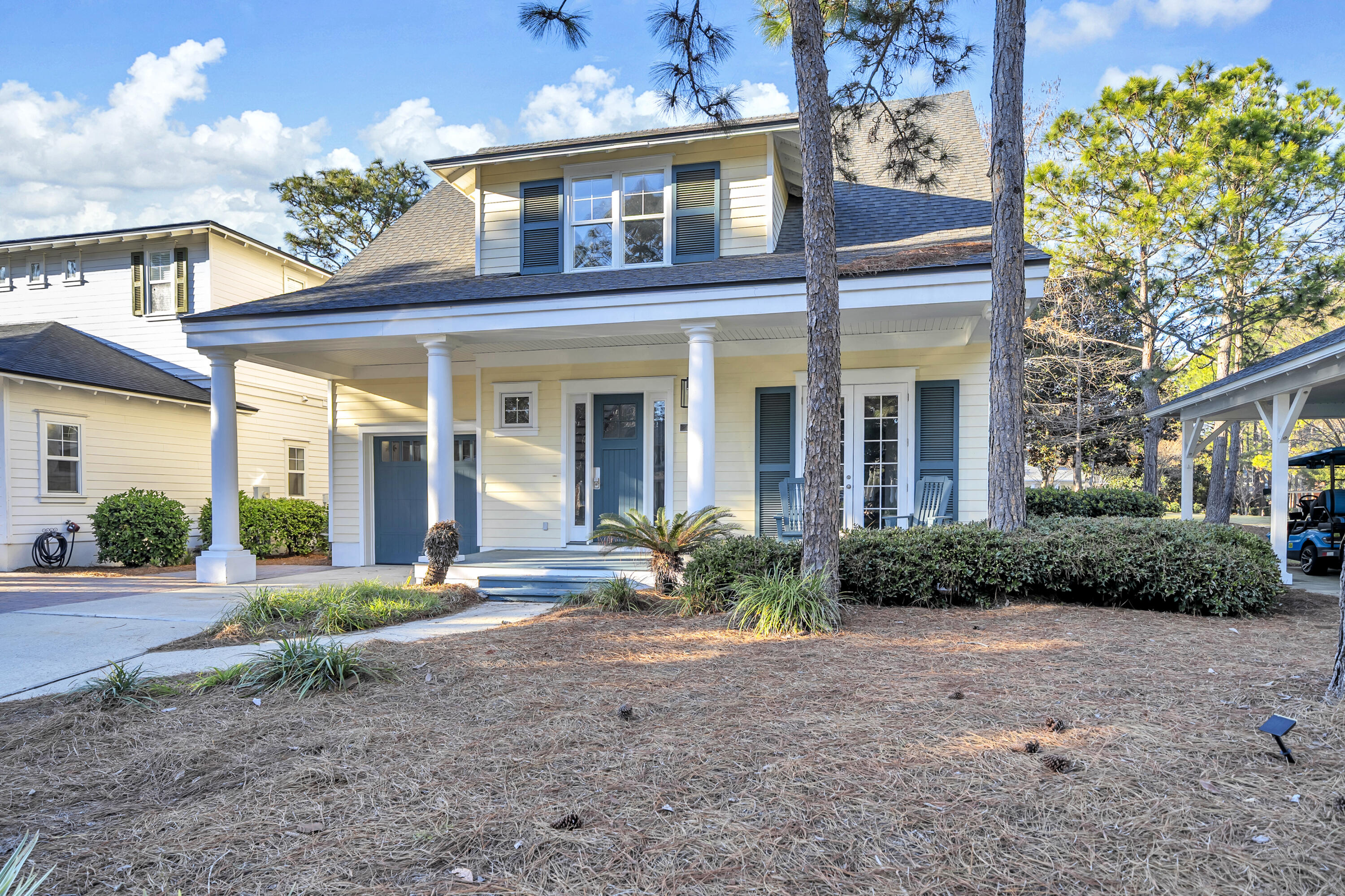 1303 Laurel Way Miramar Beach, FL 32550 - Photo 4 of 77 a view of a brick house with a yard and plants