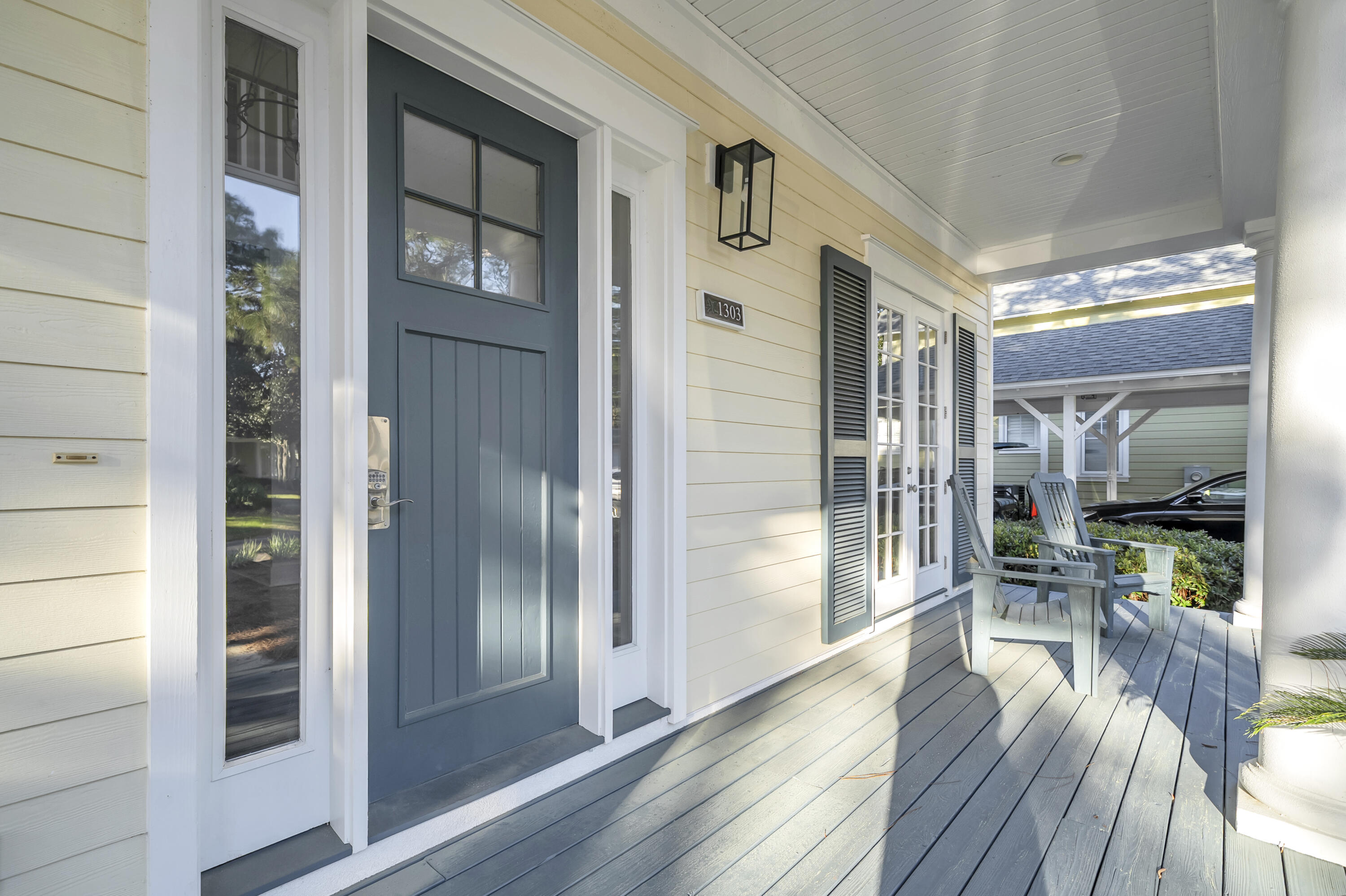 1303 Laurel Way Miramar Beach, FL 32550 - Photo 5 of 77 a view of a hallway with wooden floor and a living room