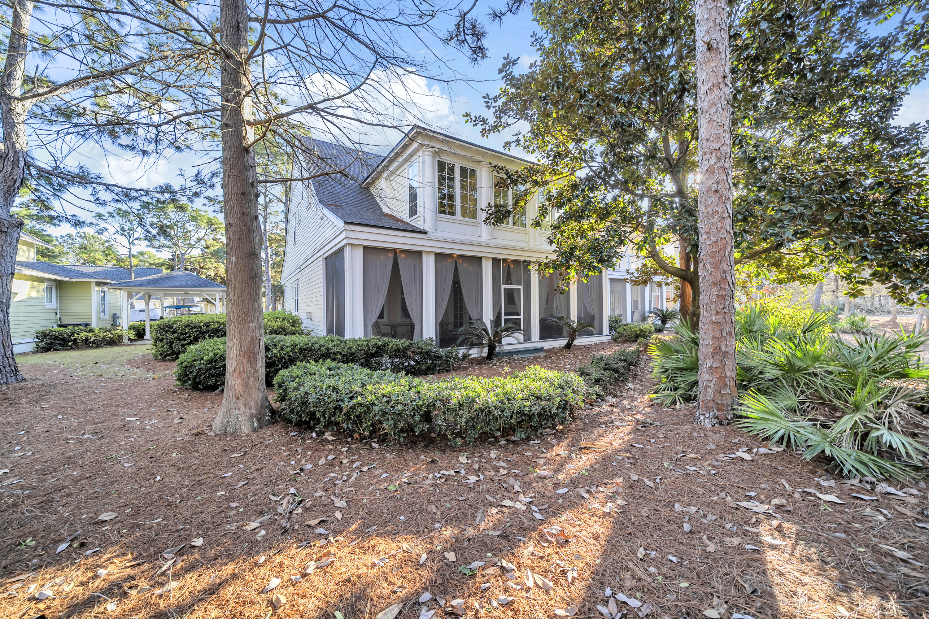 1303 Laurel Way Miramar Beach, FL 32550 - Photo 56 of 77 a front view of a house with garden